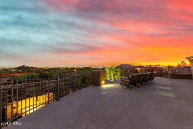 back of property with an outdoor hangout area, a patio area, and a balcony