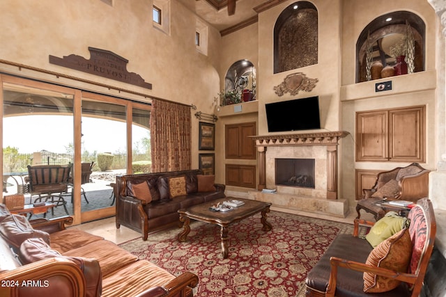 tiled living room featuring a high end fireplace, coffered ceiling, a high ceiling, and crown molding