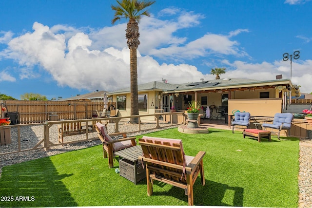 view of yard with outdoor lounge area, a patio, and a fenced backyard