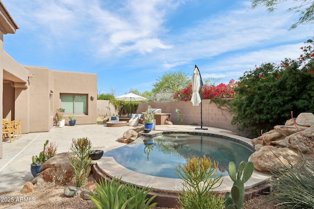 view of pool featuring a fenced backyard, a patio, and a fenced in pool