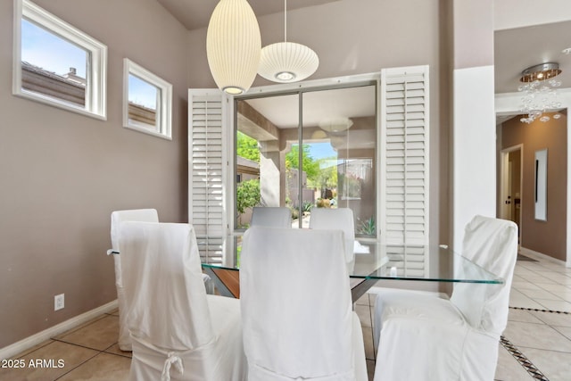 tiled dining room with baseboards