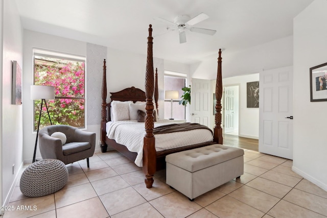 bedroom with baseboards, a ceiling fan, and light tile patterned floors