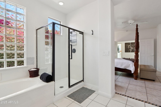 ensuite bathroom featuring a healthy amount of sunlight, ensuite bathroom, and a stall shower