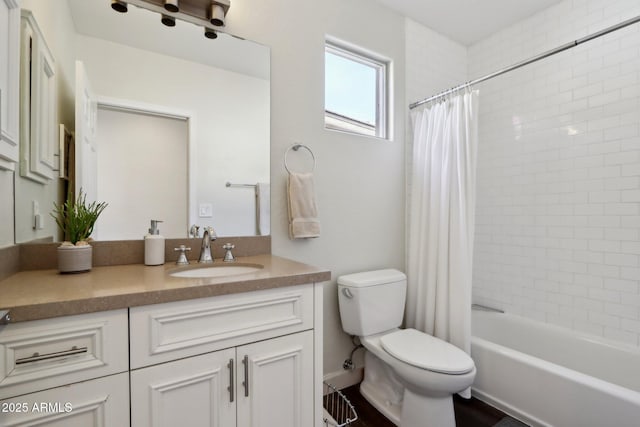 full bathroom featuring shower / bath combo, toilet, and vanity