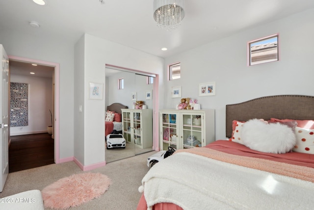 bedroom featuring baseboards, an inviting chandelier, recessed lighting, a closet, and carpet floors