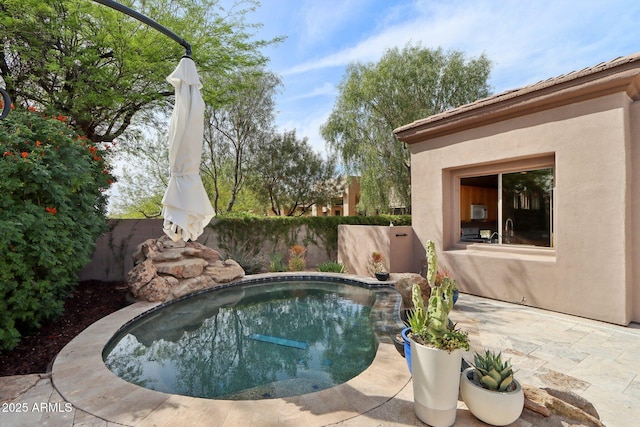 view of pool with a fenced backyard, a fenced in pool, and a patio