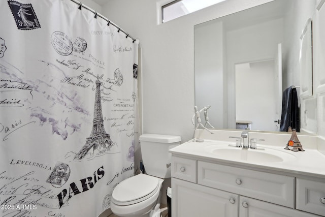 full bathroom with toilet, a shower with curtain, and vanity