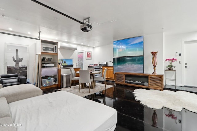 living area featuring recessed lighting and an AC wall unit