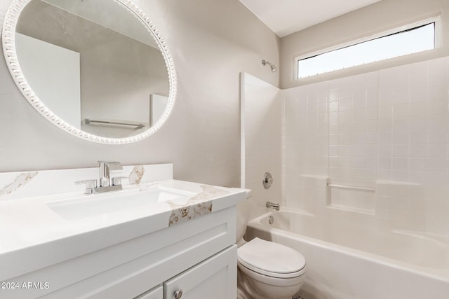 full bath with toilet, vanity, and bathing tub / shower combination