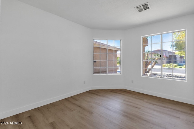 unfurnished room featuring light hardwood / wood-style flooring