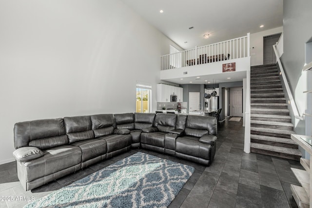 living room featuring a towering ceiling