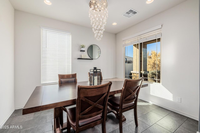 dining space featuring a notable chandelier