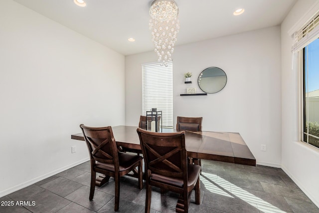 dining space with a notable chandelier