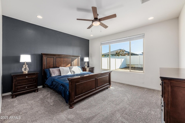 bedroom featuring light carpet and ceiling fan