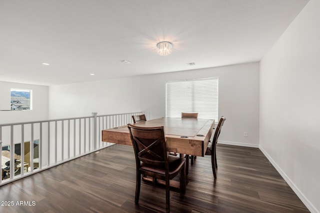 dining area with dark wood-type flooring