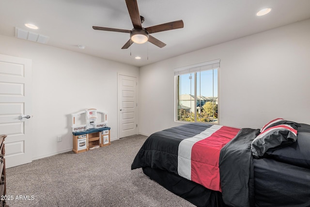 bedroom with ceiling fan and carpet floors