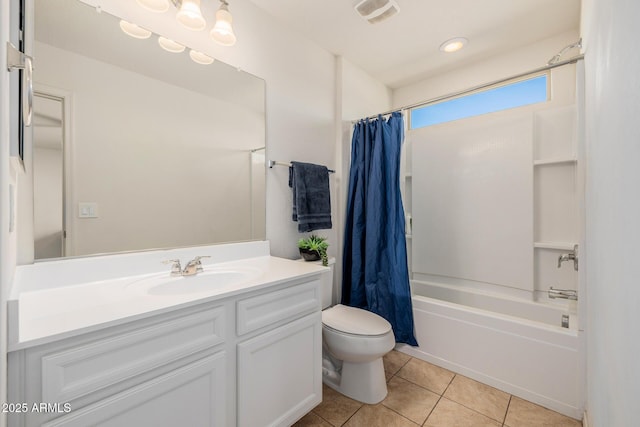 full bathroom featuring shower / bath combination with curtain, toilet, vanity, and tile patterned flooring