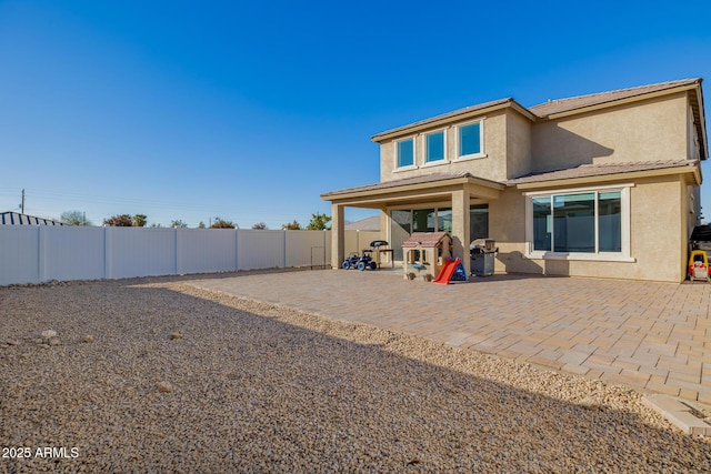 back of house featuring a patio area