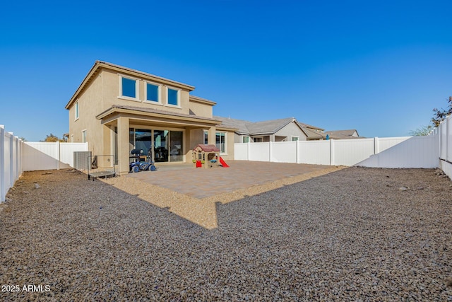 rear view of house featuring a patio