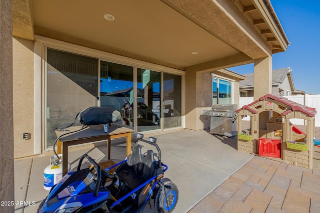 view of patio featuring a grill