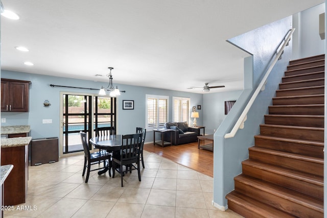 2185 E Gillcrest Rd, Gilbert, AZ 85298 - dining room featuring stairway, healthy amount of natural light, recessed lighting, light tile patterned flooring, and ceiling fan