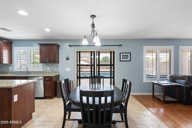 2185 E Gillcrest Rd, Gilbert, AZ 85298 - dining room featuring plenty of natural light, light tile patterned floors, recessed lighting, and baseboards