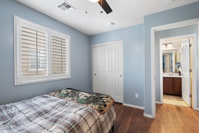 2185 E Gillcrest Rd, Gilbert, AZ 85298 - bedroom with wood finished floors, a closet, baseboards, a sink, and a ceiling fan