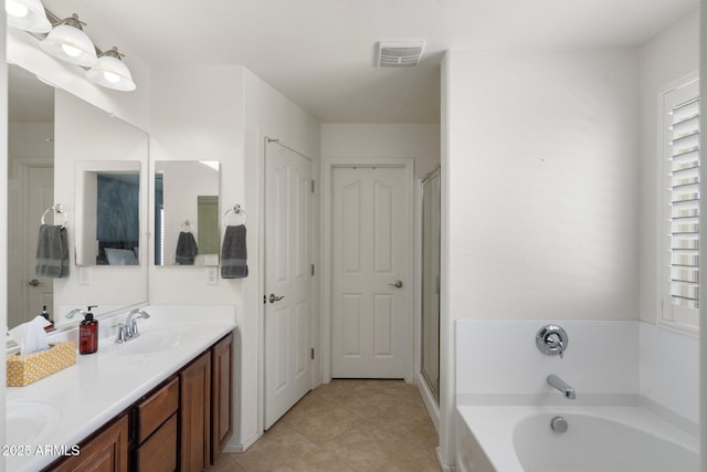 2185 E Gillcrest Rd, Gilbert, AZ 85298 - bathroom with a garden tub, double vanity, tile patterned floors, and a shower with shower door