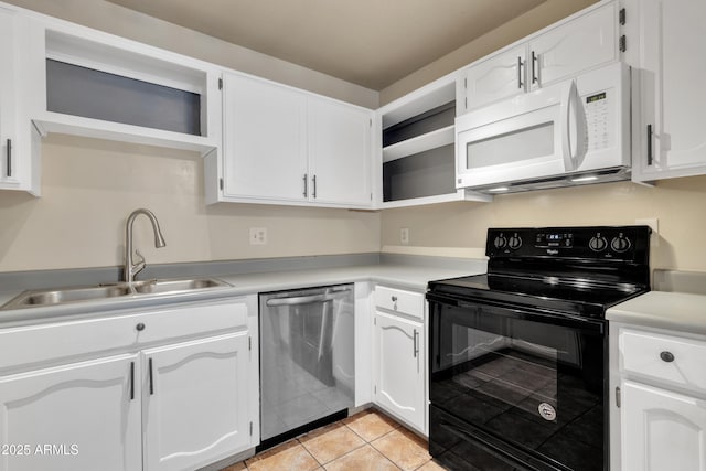 kitchen featuring white cabinets, dishwasher, a sink, white microwave, and black electric range