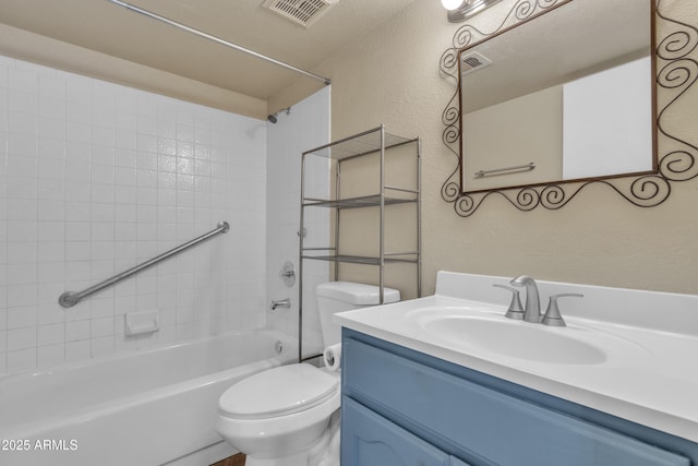 full bathroom with toilet, visible vents, shower / washtub combination, a textured wall, and vanity