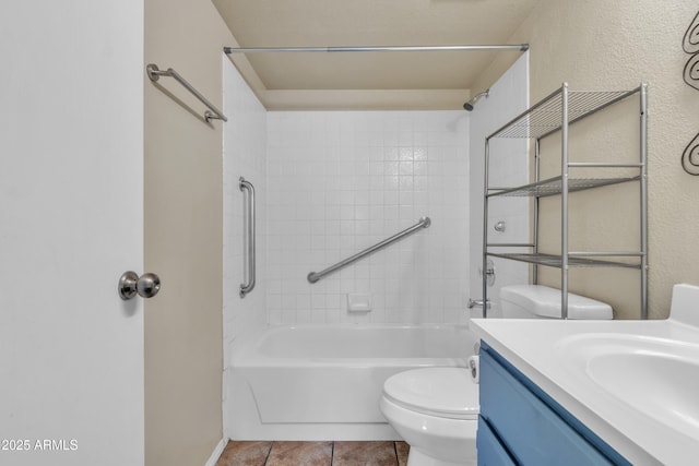 full bath with shower / bathtub combination, vanity, tile patterned flooring, and toilet