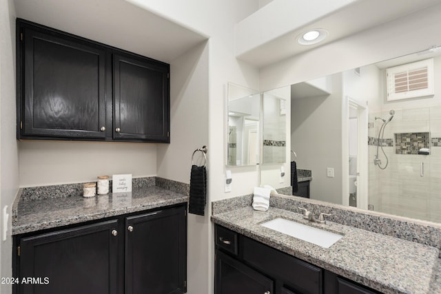 bathroom featuring vanity and walk in shower