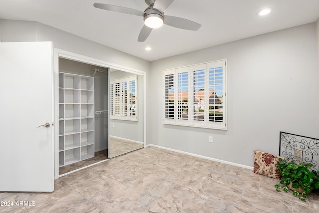 unfurnished bedroom featuring a closet and ceiling fan