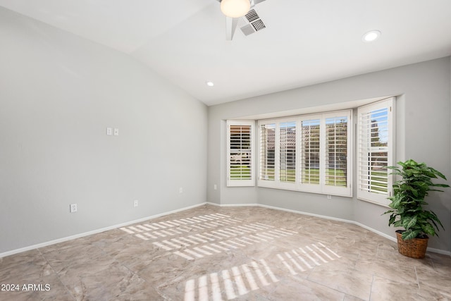 unfurnished room featuring ceiling fan and vaulted ceiling