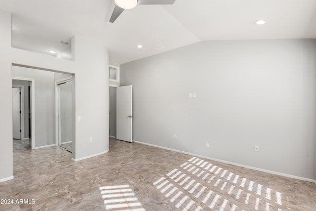 unfurnished bedroom with ceiling fan and lofted ceiling