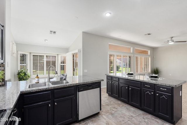 kitchen featuring stainless steel dishwasher, ceiling fan, light stone counters, and sink