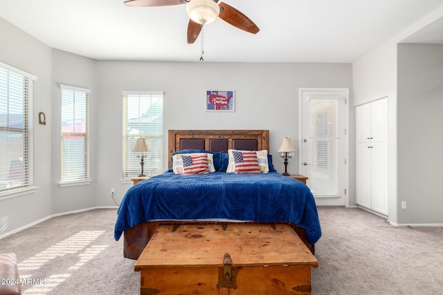 bedroom featuring ceiling fan and light carpet