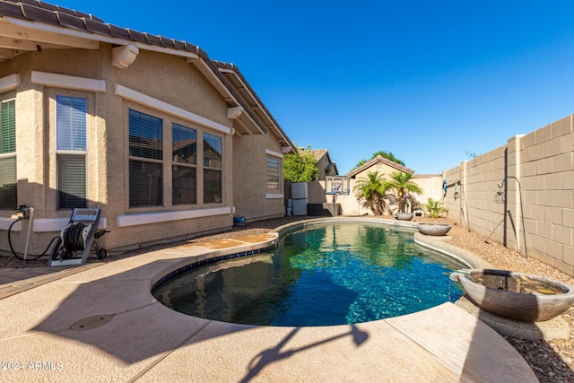 view of swimming pool with a patio