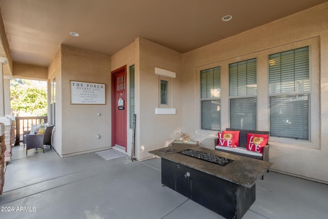 view of patio / terrace with covered porch and an outdoor fire pit