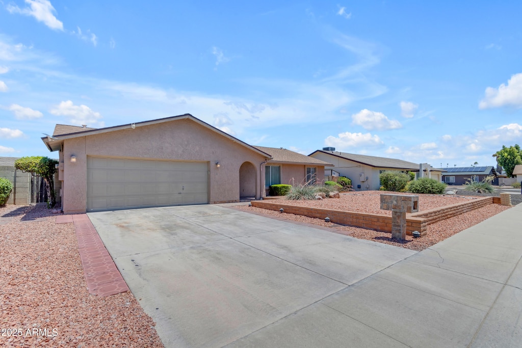 12029 N 44th Dr, Glendale, AZ 85304 - single story home with an attached garage, stucco siding, and concrete driveway