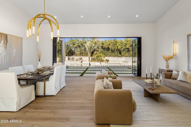 interior space featuring an inviting chandelier and light hardwood / wood-style floors