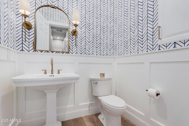 bathroom featuring sink and toilet