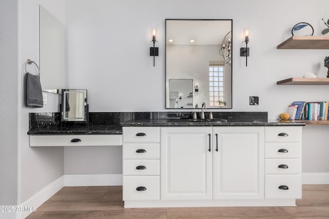 bathroom with wood-type flooring and vanity