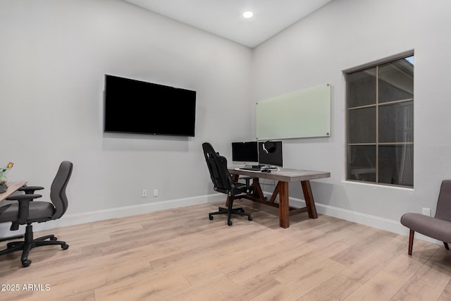 office space with light hardwood / wood-style flooring