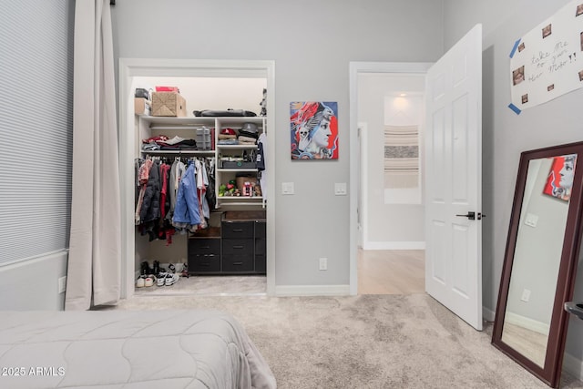 carpeted bedroom with a closet