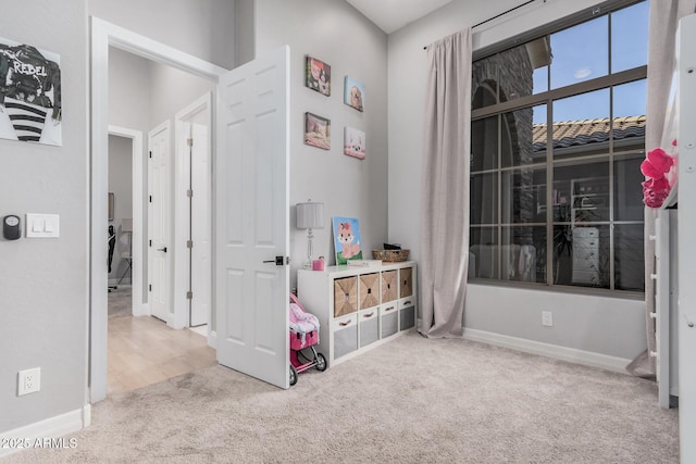 playroom with light colored carpet