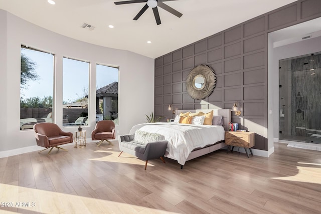 bedroom with ceiling fan and light wood-type flooring