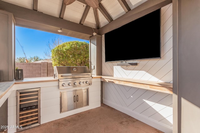 view of patio / terrace featuring a gazebo, beverage cooler, ceiling fan, and area for grilling