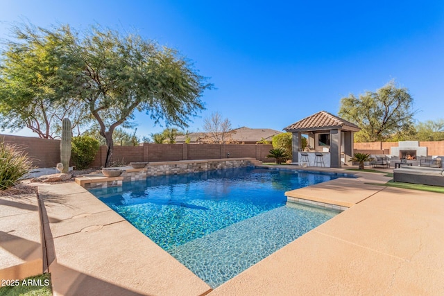 view of swimming pool with a bar, a patio area, and an outdoor living space