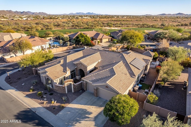 birds eye view of property featuring a mountain view